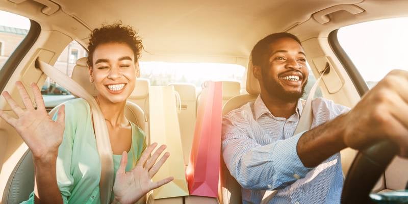 James Wood Motors Decatur in Decatur TX view of couple driving in their new car