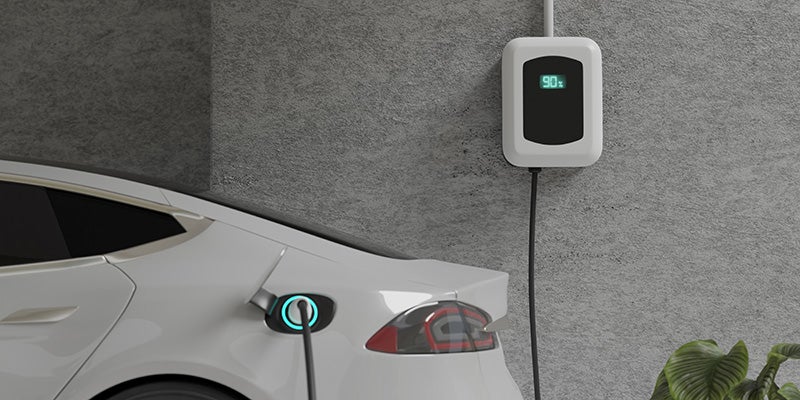 James Wood Motors Decatur in Decatur TX close up of an electric car charging at home